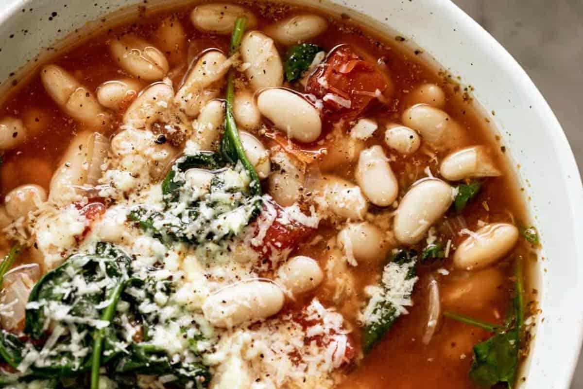 Close-up shot of White Bean Soup with Parmesan.