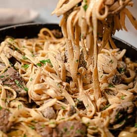 Creamy Beef and Mushroom Stroganoff served over pasta OR noodles in a bowl