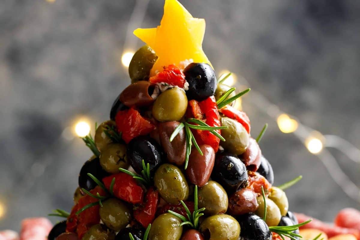 Cut a star from yellow or orange bell pepper or use a thick slice of cheese and set it on top. Serve with crackers, rolled salami, and prosciutto.