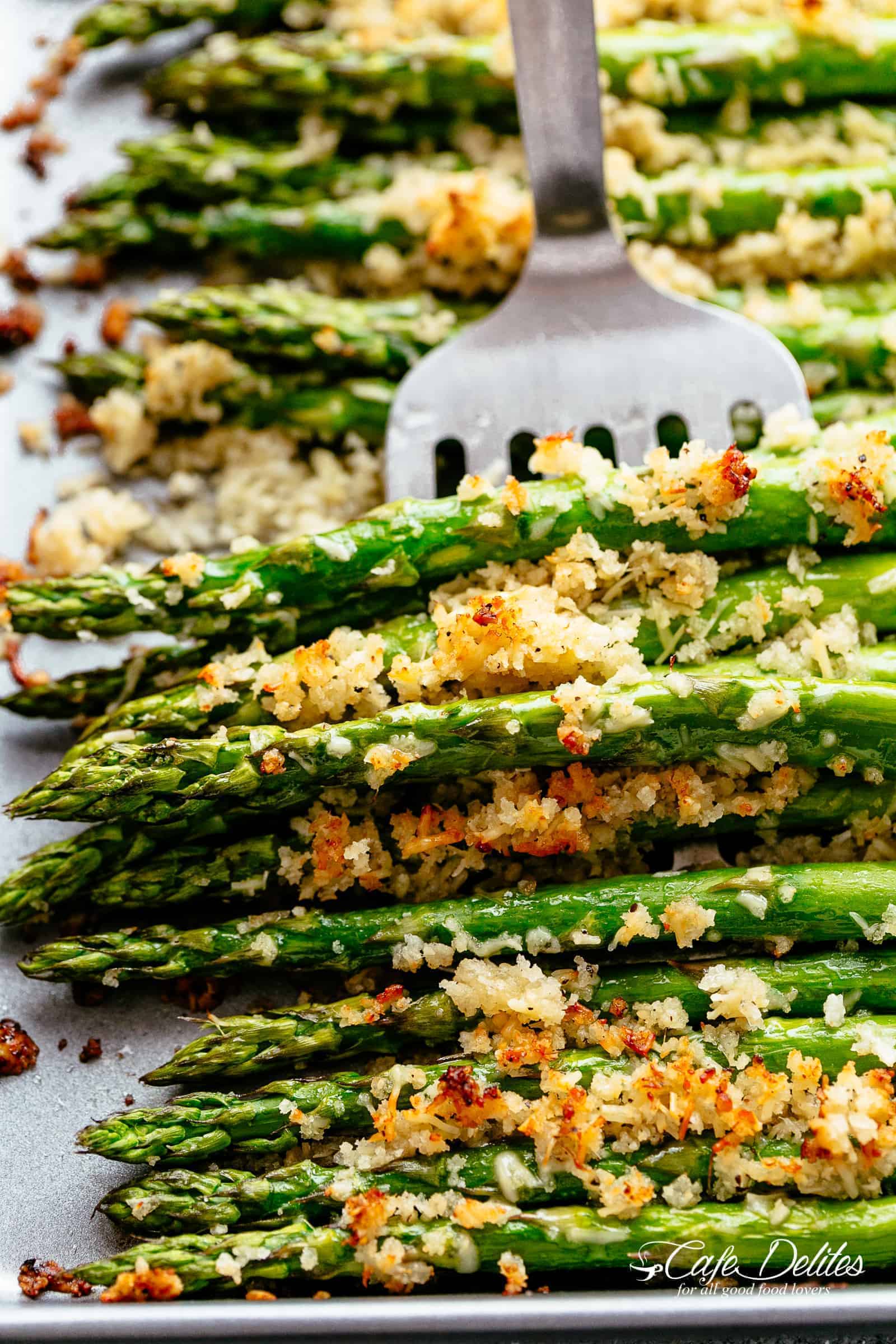 Garlic Butter Asparagus with Crispy Parmesan with silver fork