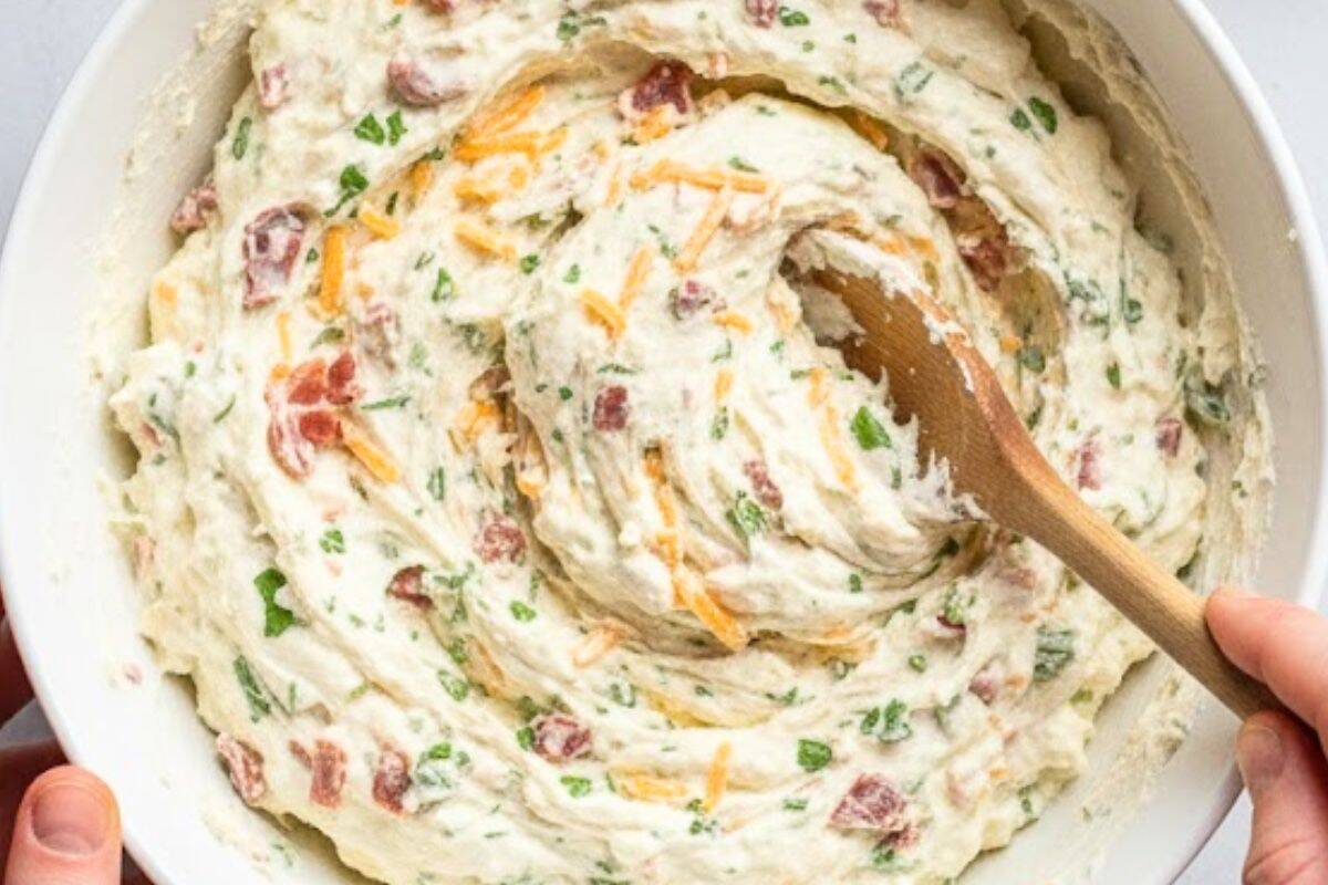 In a large bowl, combine all the dip ingredients, cream cheese, bacon, cheddar, herbs, and seasonings