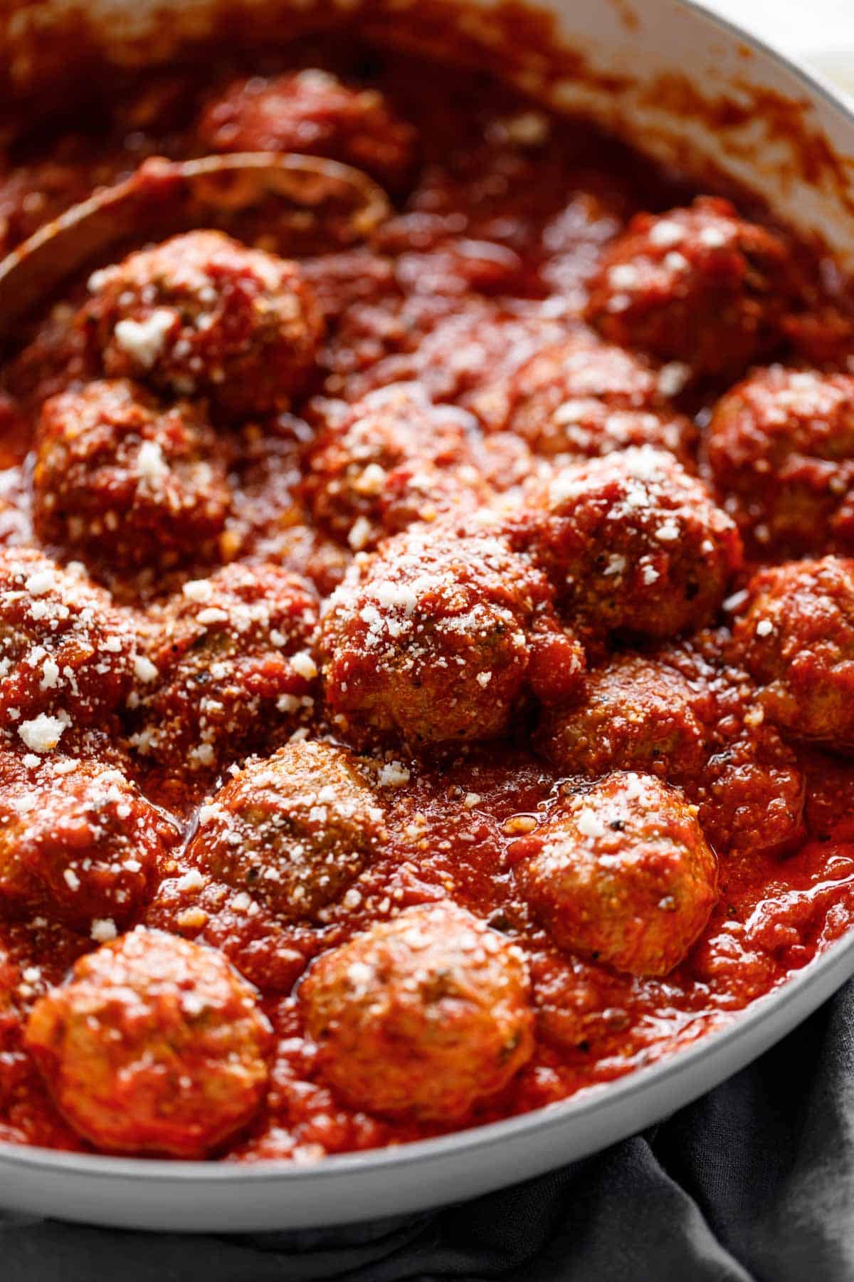 Easy Baked Meatballs soaked in tomato marinara sauce
