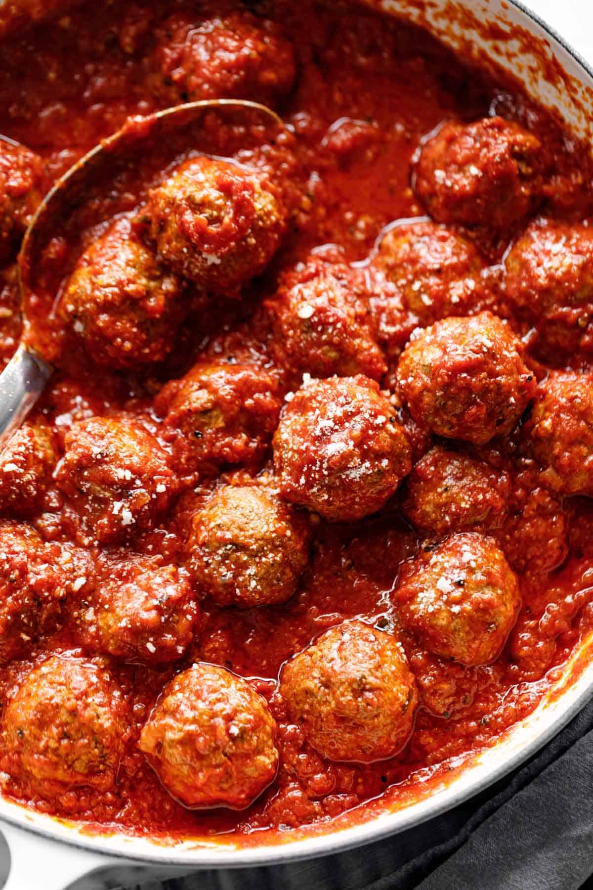 Easy Baked Meatballs in a pan with tomato sauce