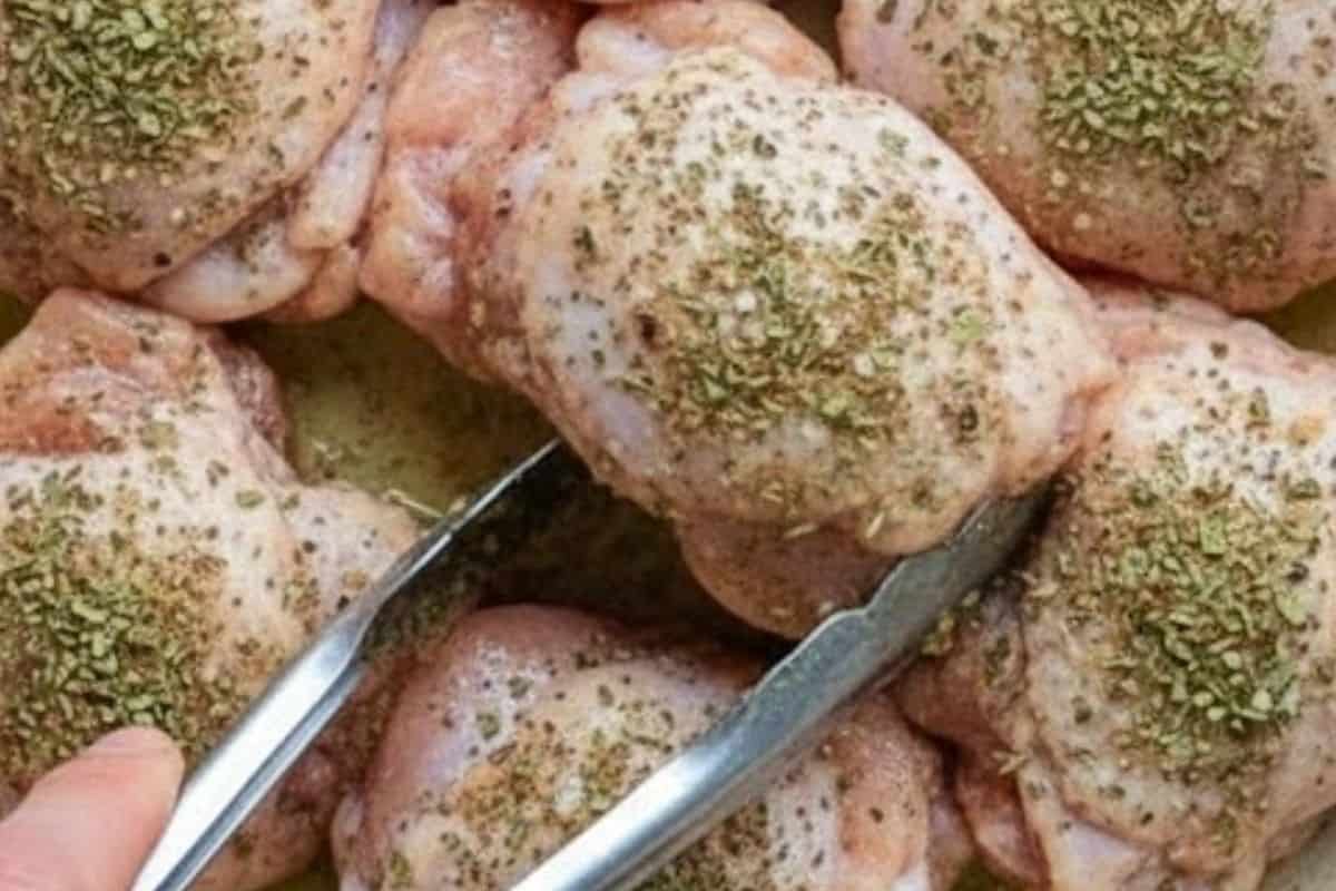 Coat the chicken thighs with oregano, basil, salt, and pepper