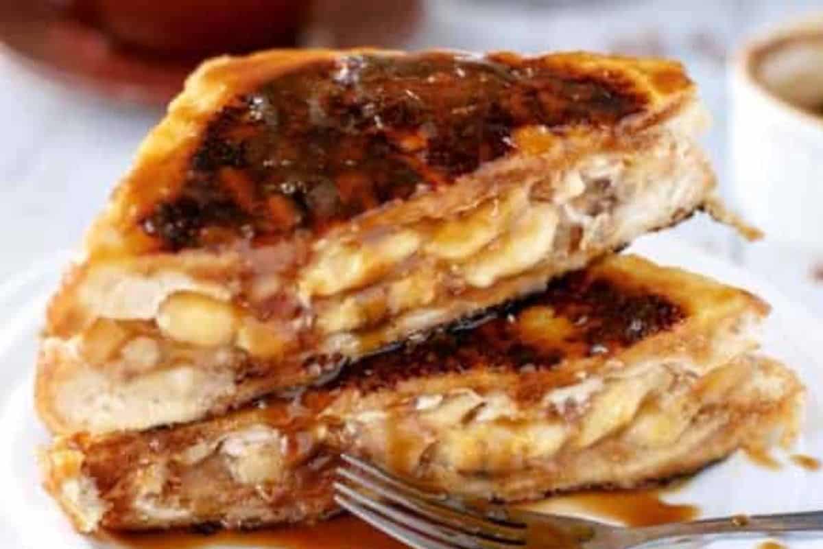 Slowly add milk, let sauce simmer until thickened, adjust with water if needed, whisk smooth, and drizzle over the toast.