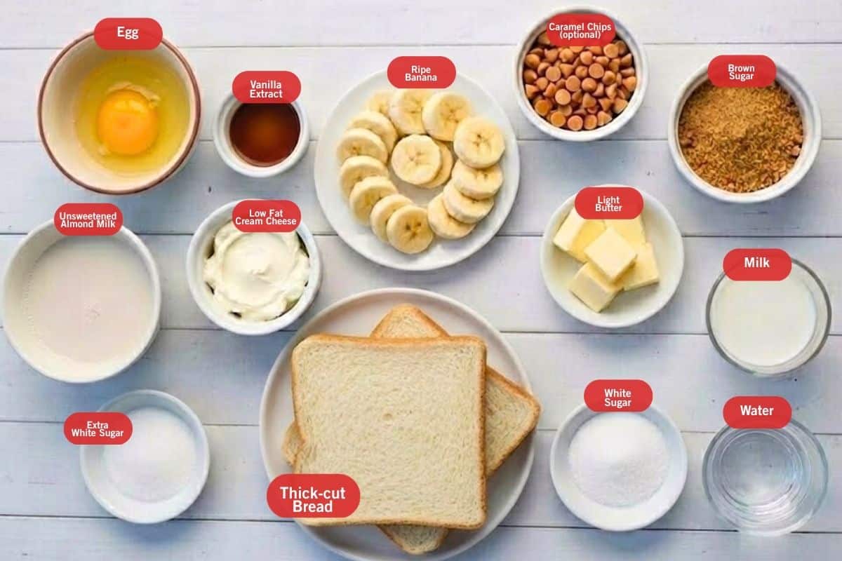 Flat lay photo of egg, vanilla extract, ripe bananas, caramel chips, brown sugar, milk, water, white sugar, extra white sugar, low fat cream cheese, unsweetened almond milk, thick cut bread