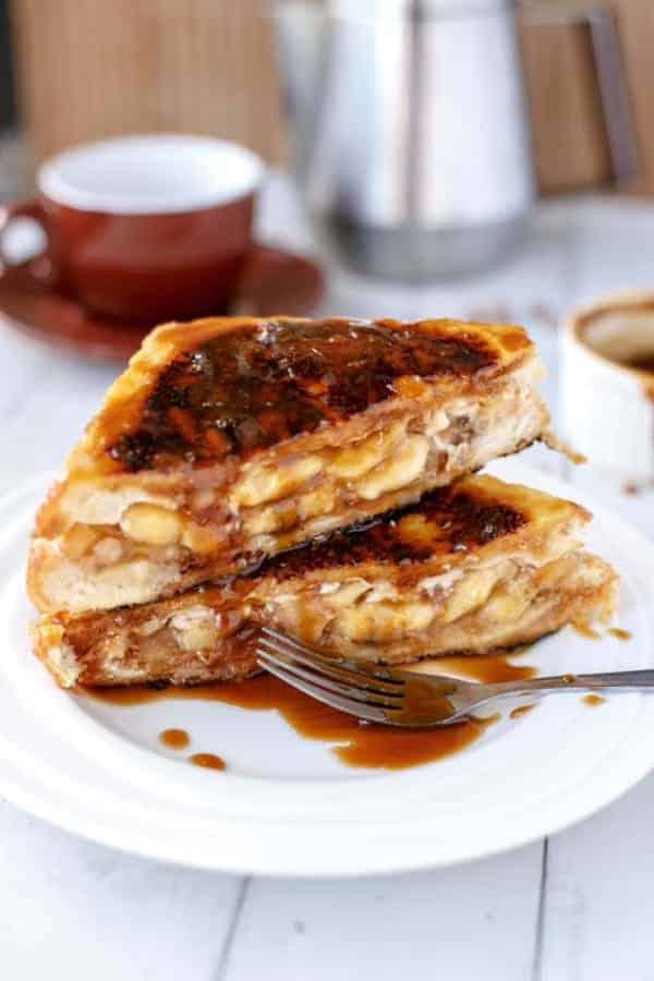 Banoffee French Toast with fork and some dressing aside