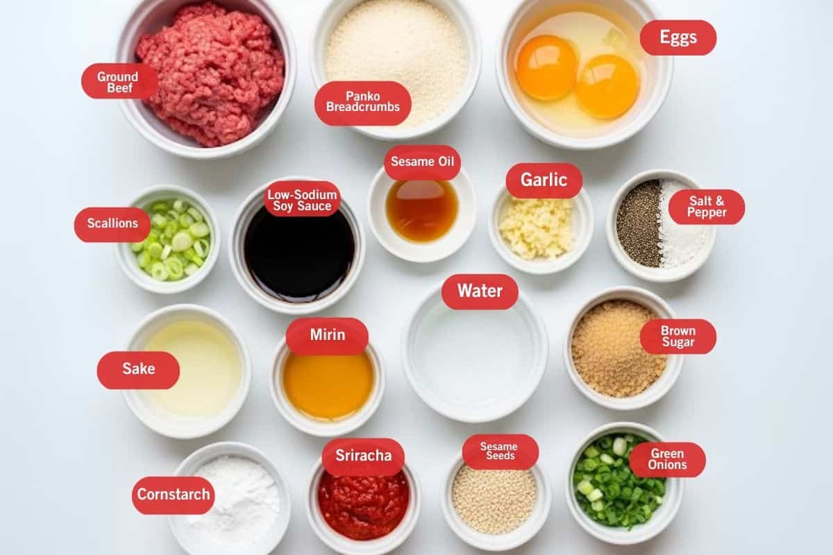 Flat lay of ingredient shot of ground beef, panko breadcrumbs, eggs, scallions, low sodium soy sauce, sesame oil, garlic, salt and pepper, brown sugar, water, mirin, sake, cornstarch, sriracha, sesame seeds, green onions