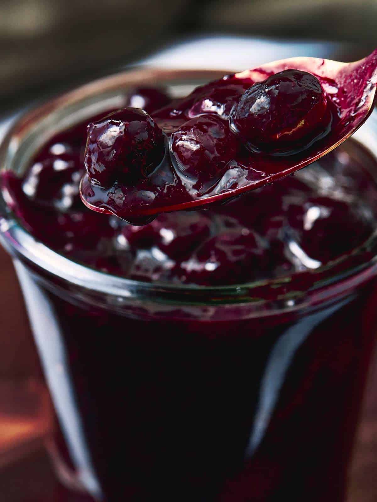 showing glass with blueberry sauce