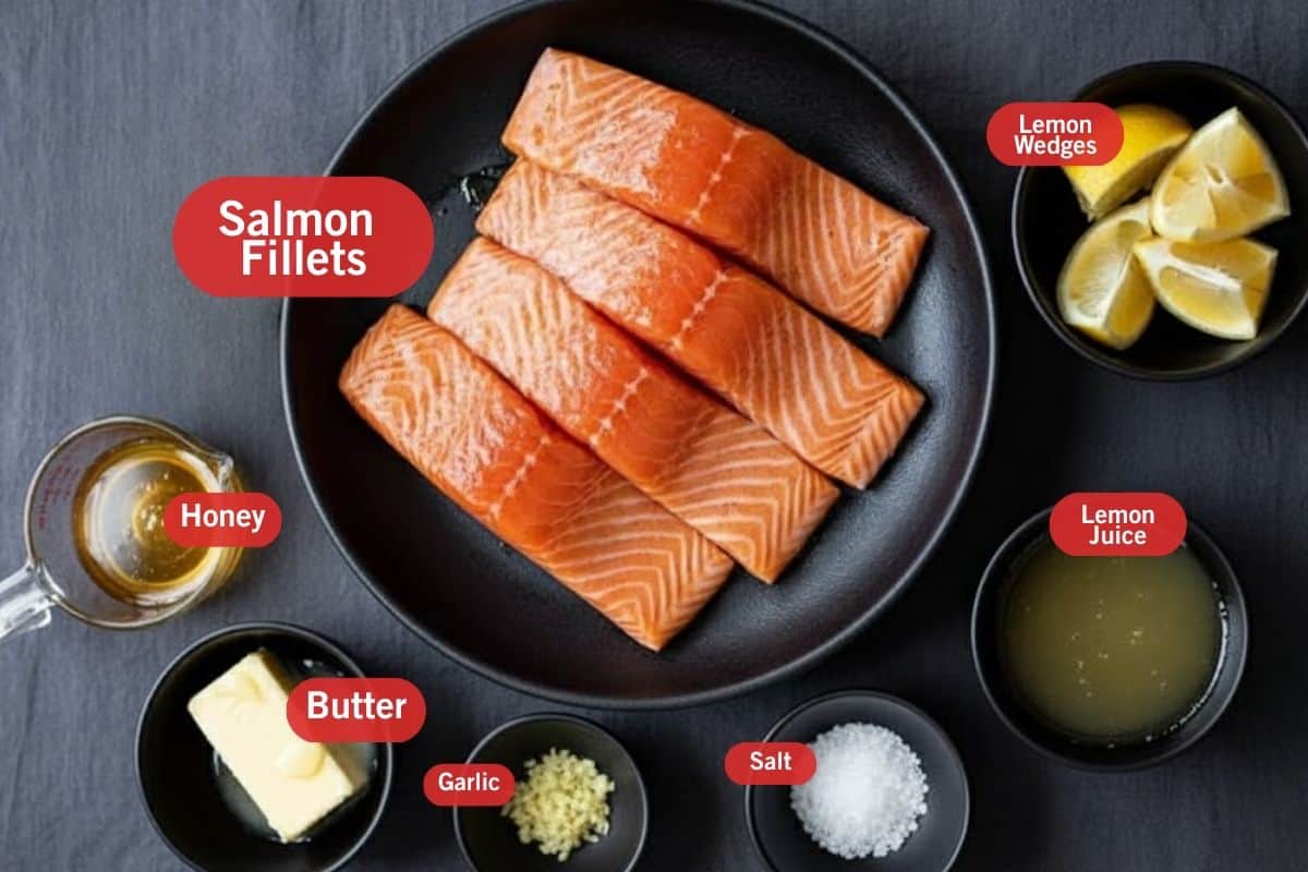 Flat lay photo of ingredient shot of salmon fillets, lemon wedges, honey, butter, garlic,salt and lemon juice