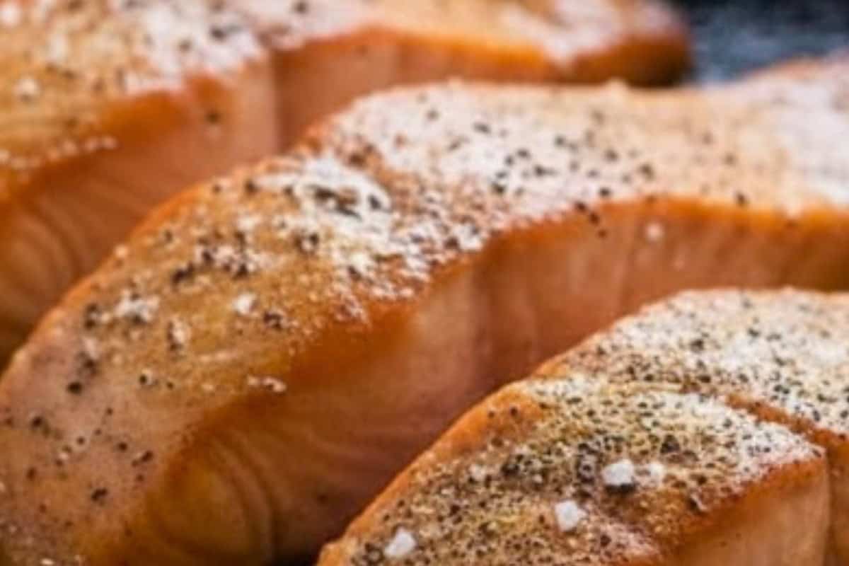 Sprinkle salt and pepper on top of the salmon and keep basting until it turns golden.