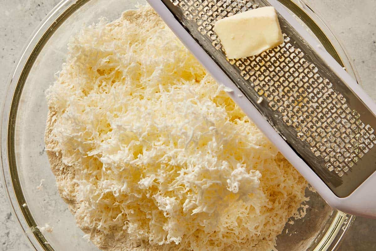 shredded butter in the dry ingredients for biscuits dough |