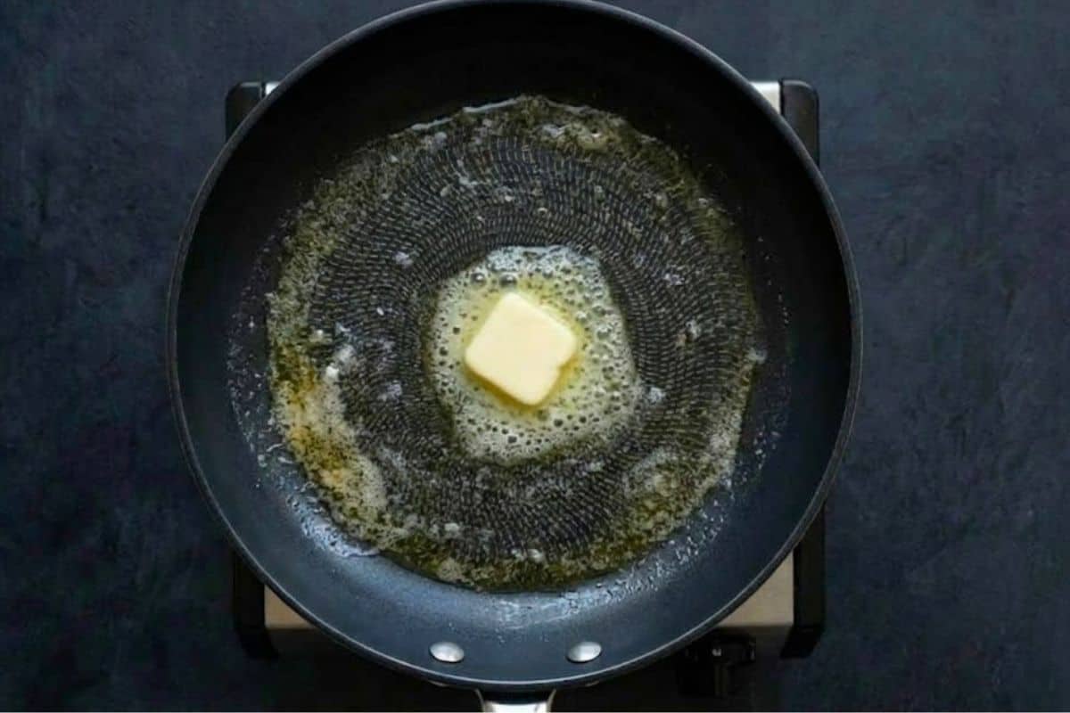 Heat a nonstick pan over low to medium heat and wipe with butter