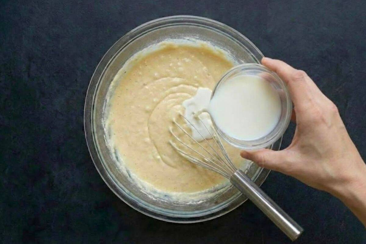 The batter should be thick and creamy. If it feels too thick to pour, fold in a tablespoon or two of extra milk at a time until it loosens slightly.