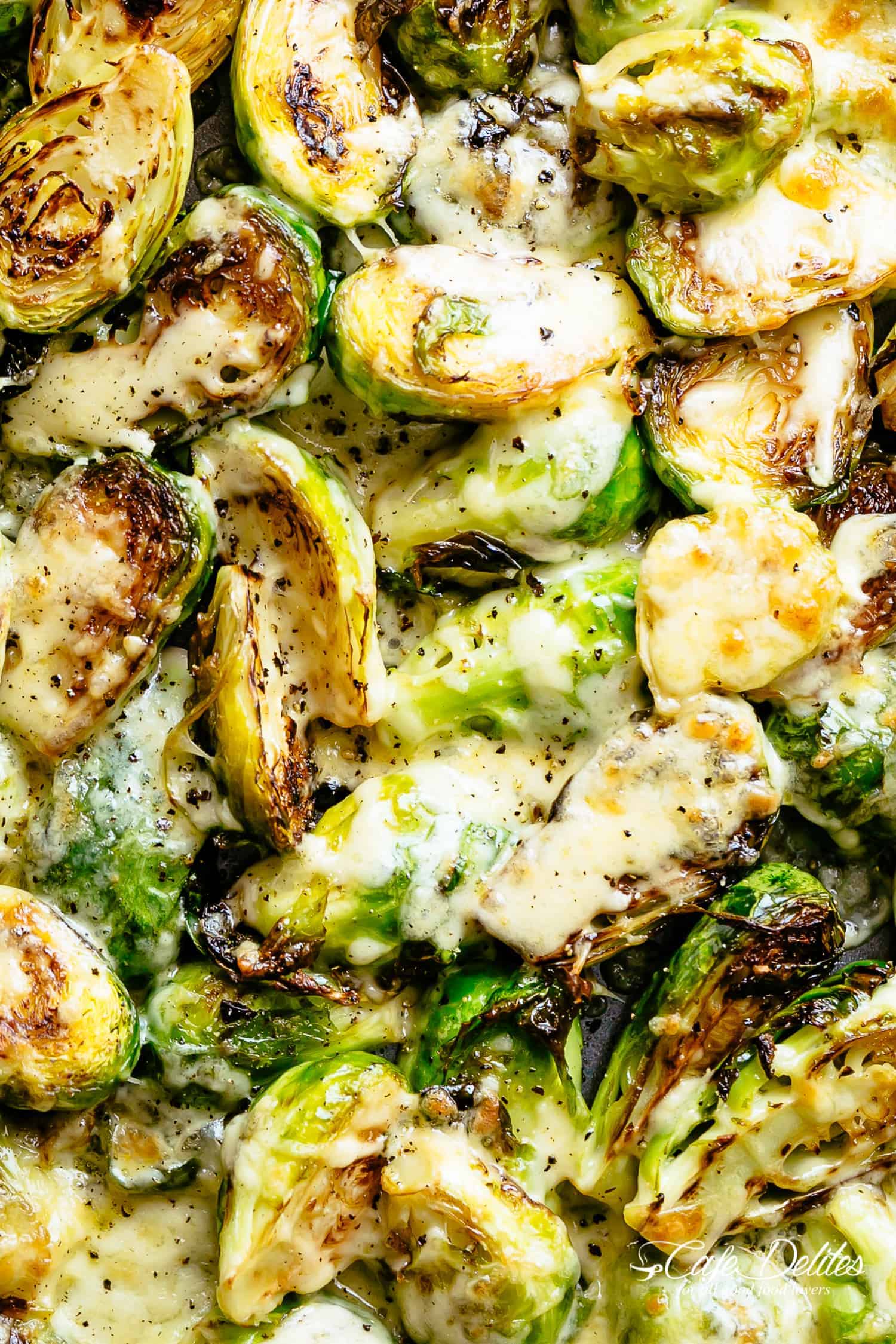 Top view image of Cheesy Garlic Roasted Brussels Sprouts Recipe caramelized and topped with melted mozzarella cheese!