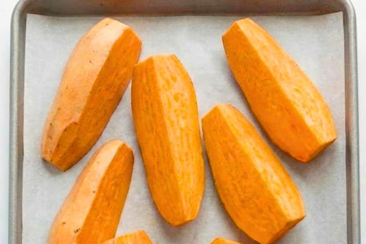 Wash, peel, and cut the sweet potatoes into quarters or six pieces