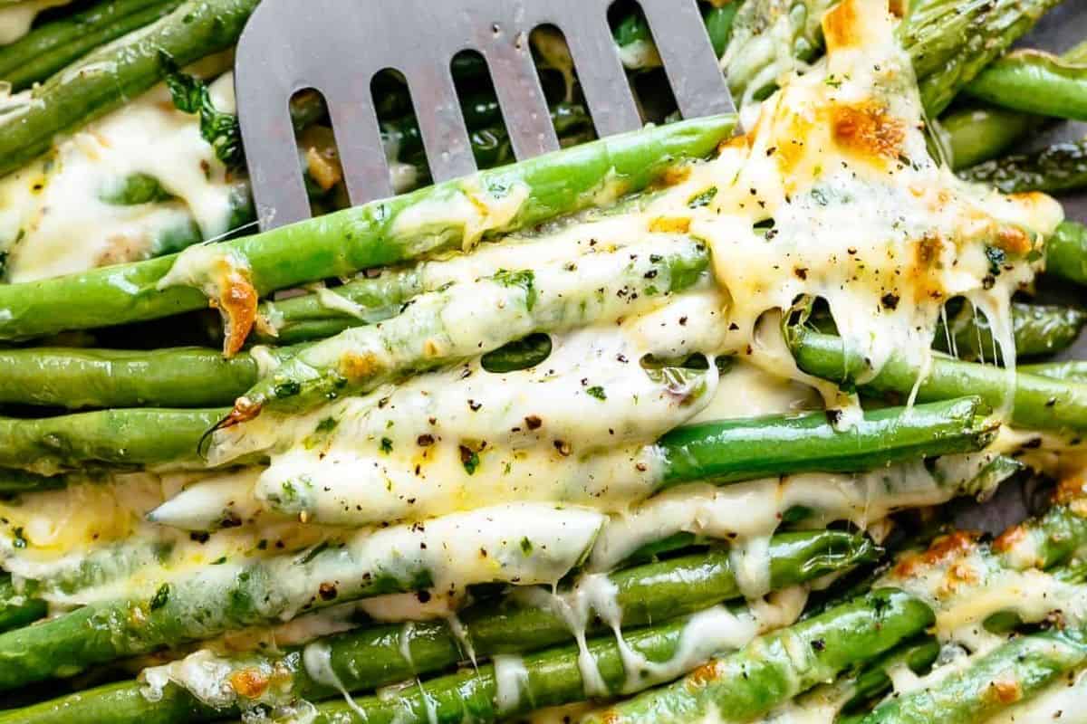 Serve the Cheesy Green Beans immediately while its hot.