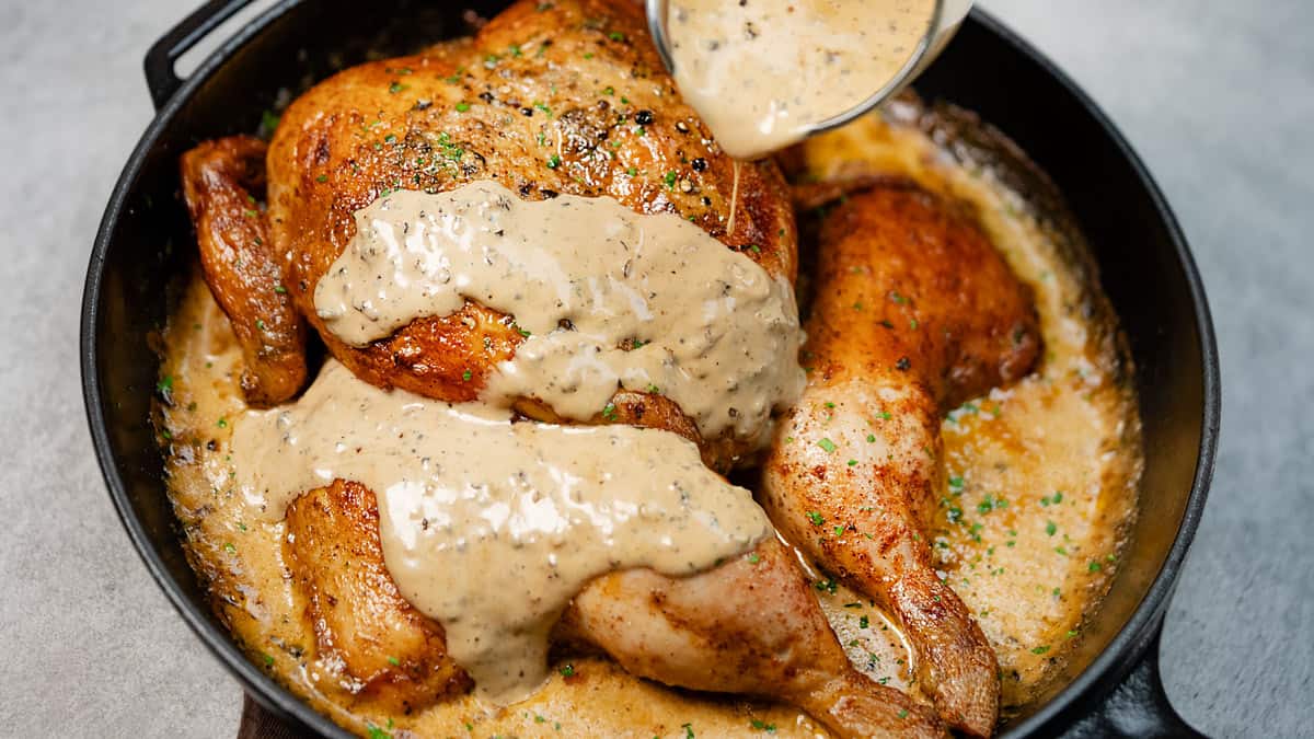 Pouring the sauce in the chicken