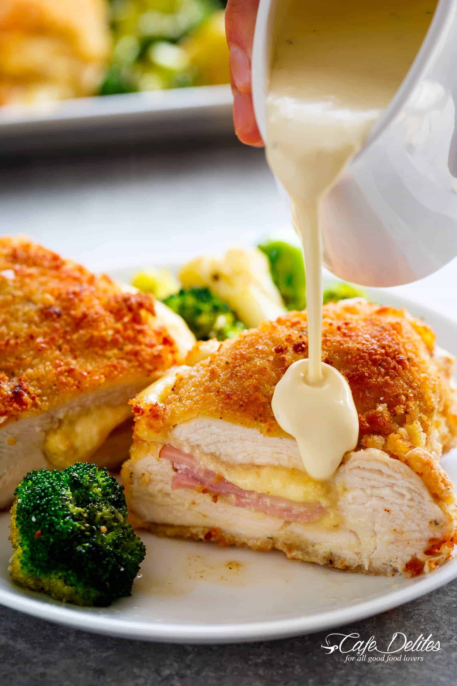 Pan Chicken Cordon Bleu, Crispy crumbed chicken breasts filled with Dijon mustard, Swiss cheese and ham, baked with vegetables and served with an good Dijon Cream Sauce for the ultimate restaurant feel right at home!