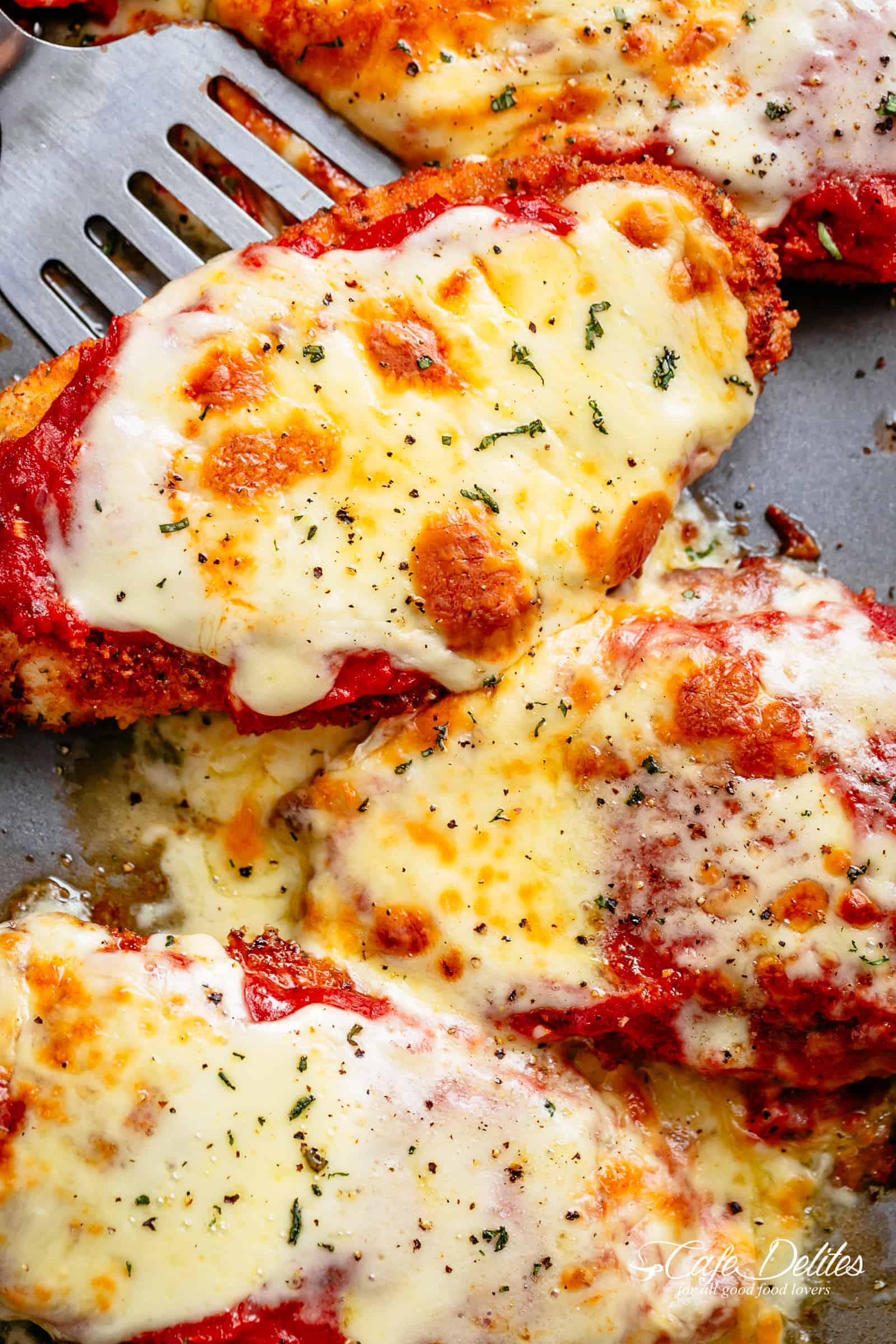 a reliable Chicken Parmesan with a deliciously crispy breadcrumb coating, smothered in a rich homemade tomato sauce and melted mozzarella cheese! This is here best Chicken Parmesan you will ever make! Simple to make and worth every minute. If you love a crispy crumb coating vs soggy crumb, look no further!