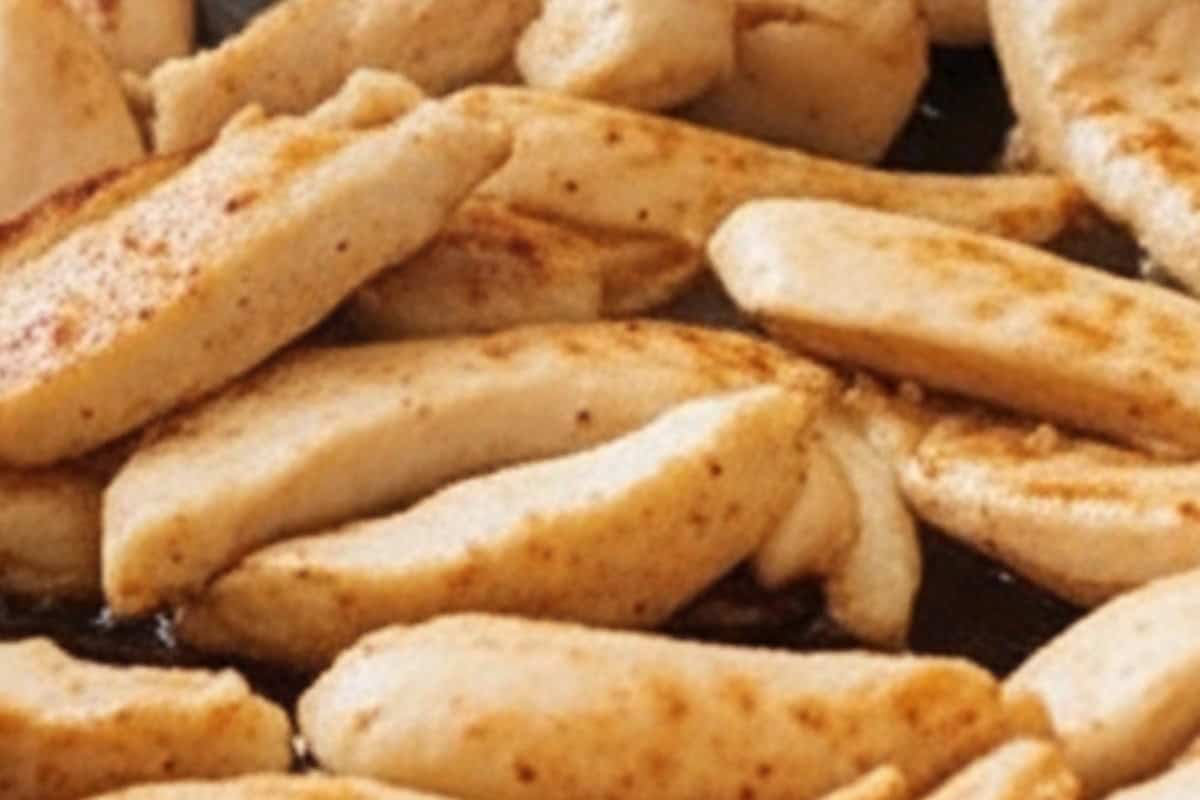 Fry the chicken in the wok until fully cooked.