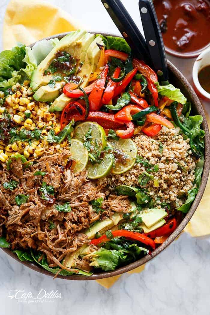 Crispy Carnitas in a salad drizzled with an good Chipotle Lime Dressing and a low carb Cilantro Lime Rice! in a pan