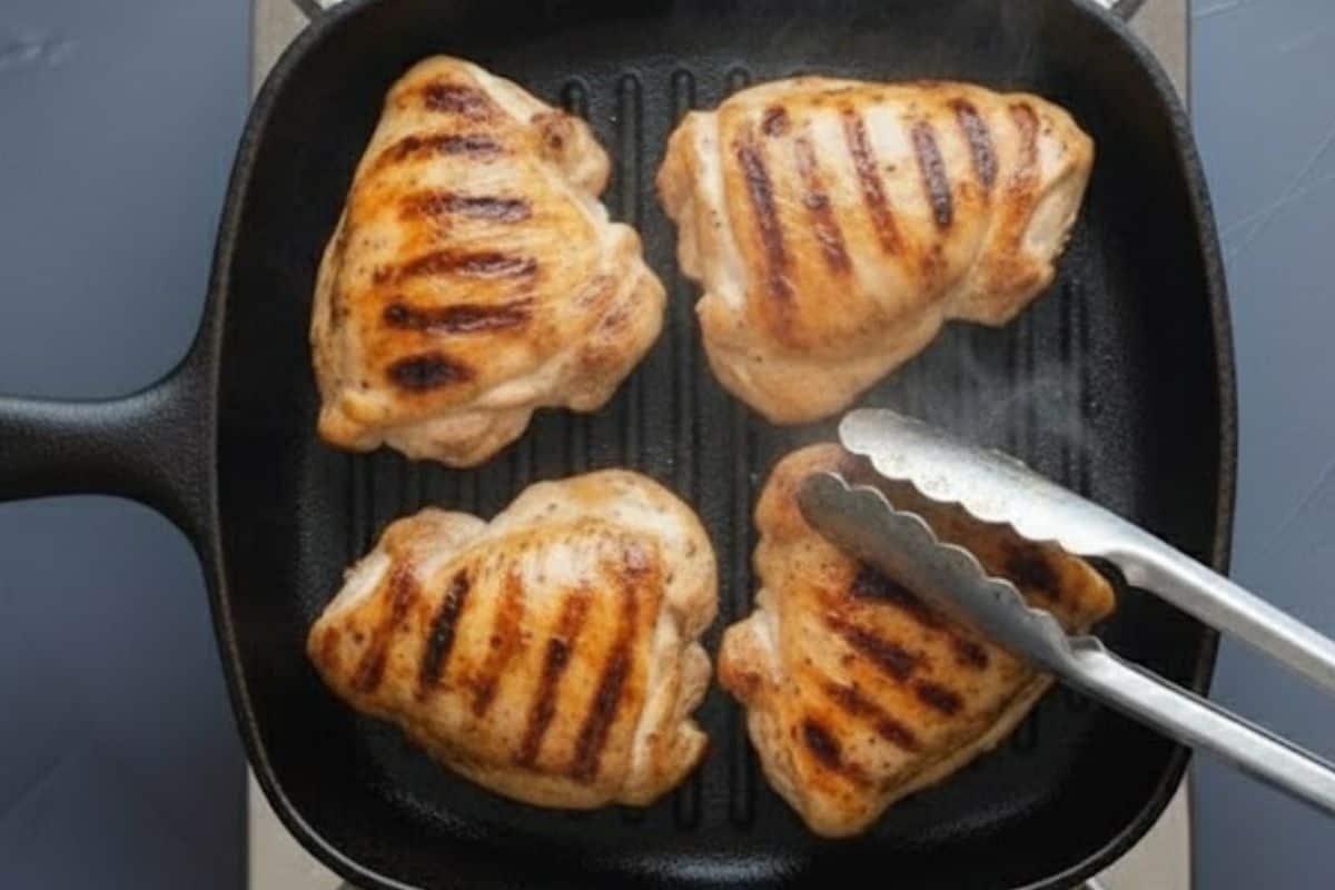Cook chicken until golden, slightly charred, and cooked