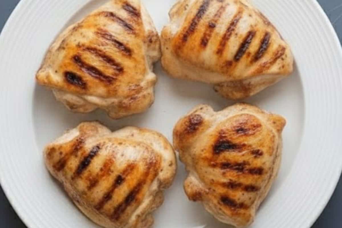 Transfer the cooked chicken to a plate and allow it to rest so the juices settle and the meat stays tender.