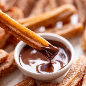 Churros dipped in chocolate sauce