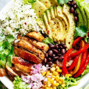 Fajita Chicken Burrito Bowl is packed with juicy golden chicken, cilantro lime rice, avocado and a good dressing