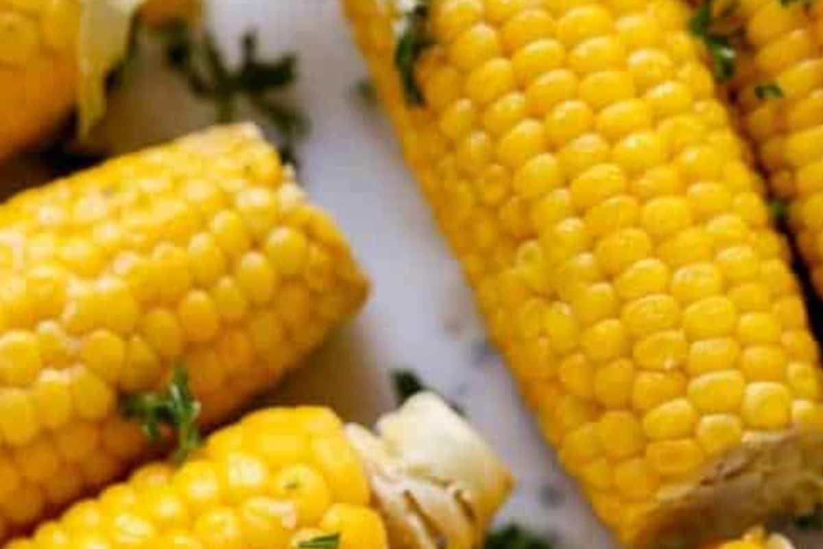 Remove each cob with tongs, brush generously with garlic butter