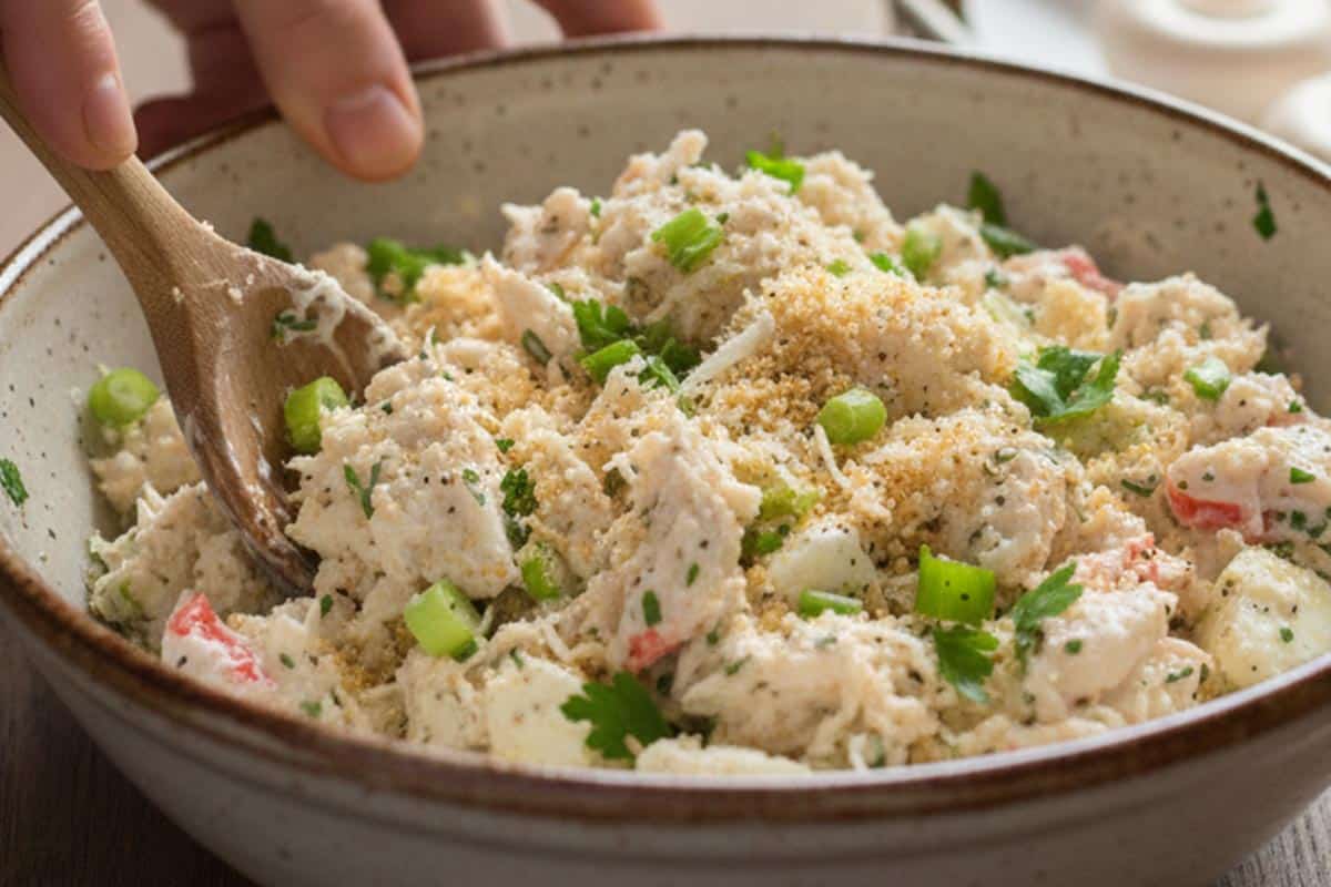 Mixed Panko crumbs, parmesan, mayonnaise, cream cheese, garlic, green onions, herbs, salt, and pepper.