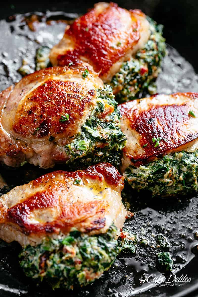 Pieces of Baked Spinach stuffed pork chops never fail to impress!
