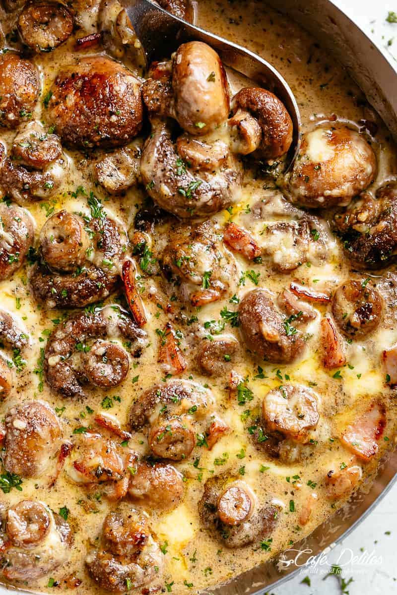 Sautéed Mushroom recipe with cheese, cream and bacon in a skillet