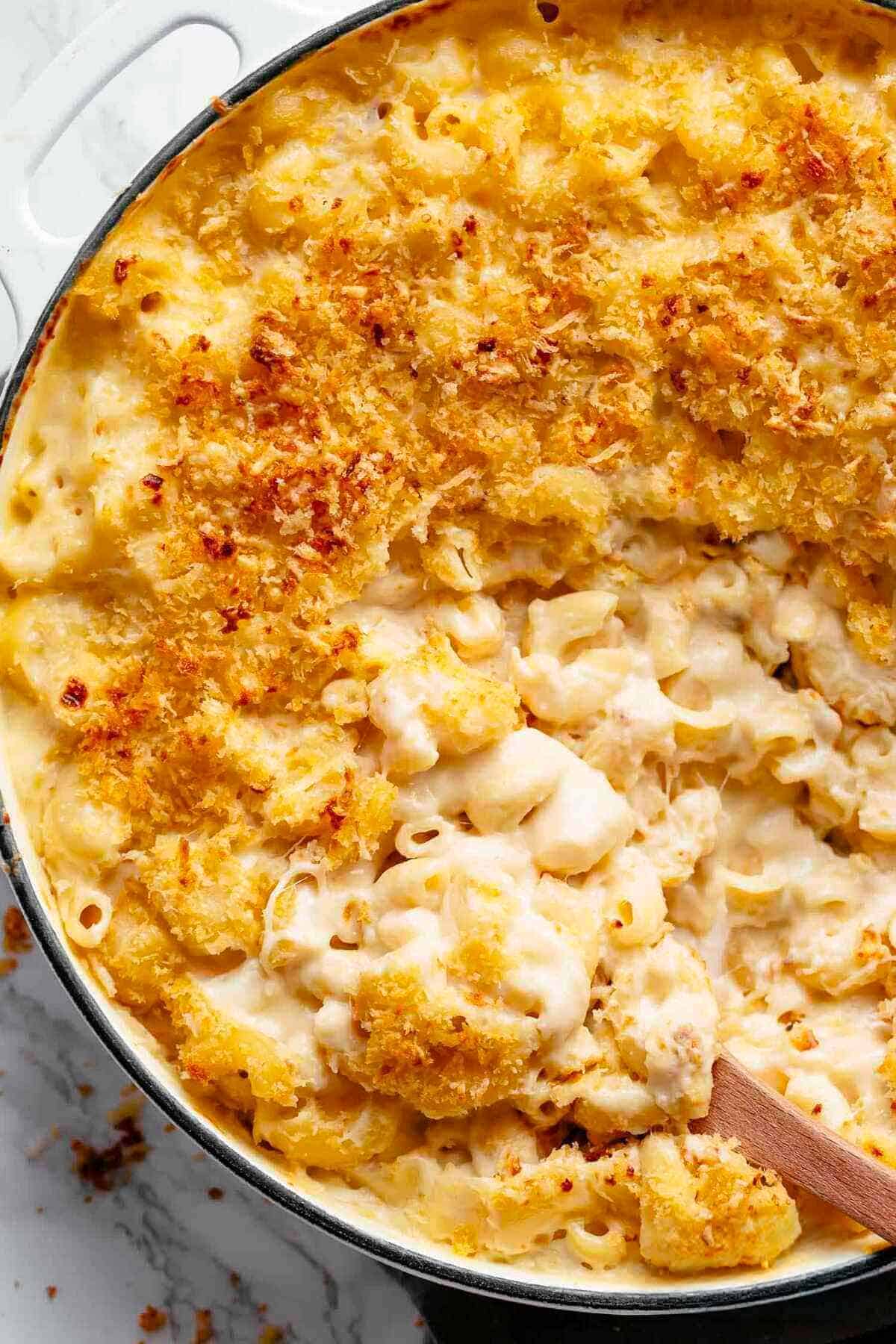 Mac And Cheese is better than the original! A creamy garlic parmesan cheese sauce coats your macaroni, topped with parmesan fried bread crumbs, while saving some calories! |