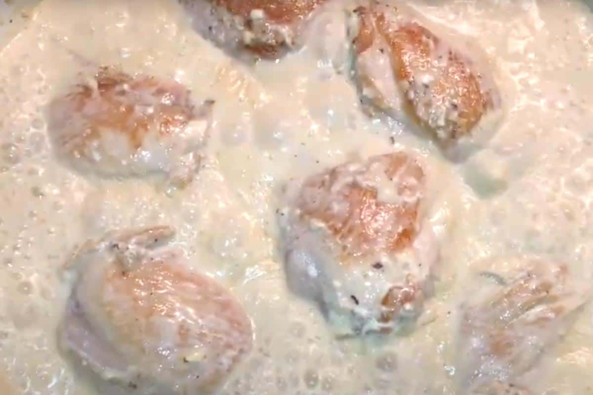Poured in the chicken broth, bringing it to a gentle boil.