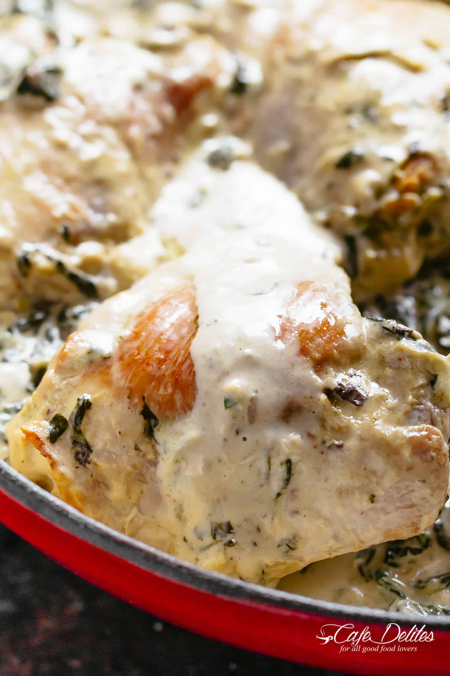 Creamy Spinach Artichoke Chicken Thighs in one skillet! Low fat AND low carb, filled with fresh spinach, artichokes, parmesan cheese and a hint of garlic!