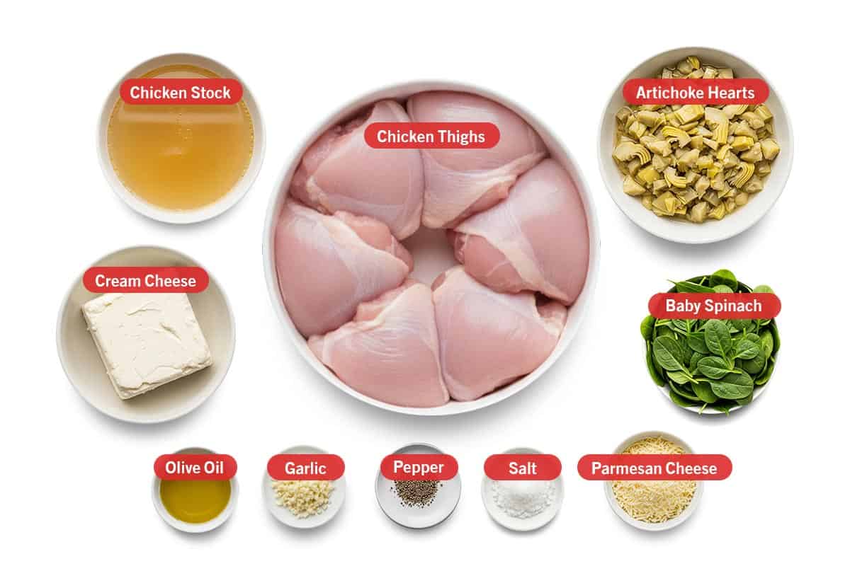 Top shot of ingredients: chicken stock, cream cheese, olive oil, garlic, pepper, salt, parmesan cheese, chicken thighs, artichoke hearts, and baby spinach.