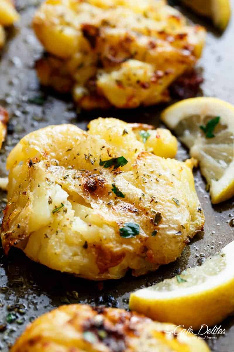 Side view zoom in image of Crispy Greek Lemon Smashed Potatoes are Crispy and golden on the outside, soft and fluffy on the inside!
