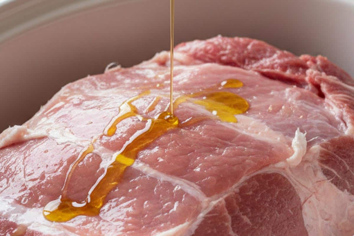 Placed the pork in the slow cooker bowl and drizzle with olive oil.