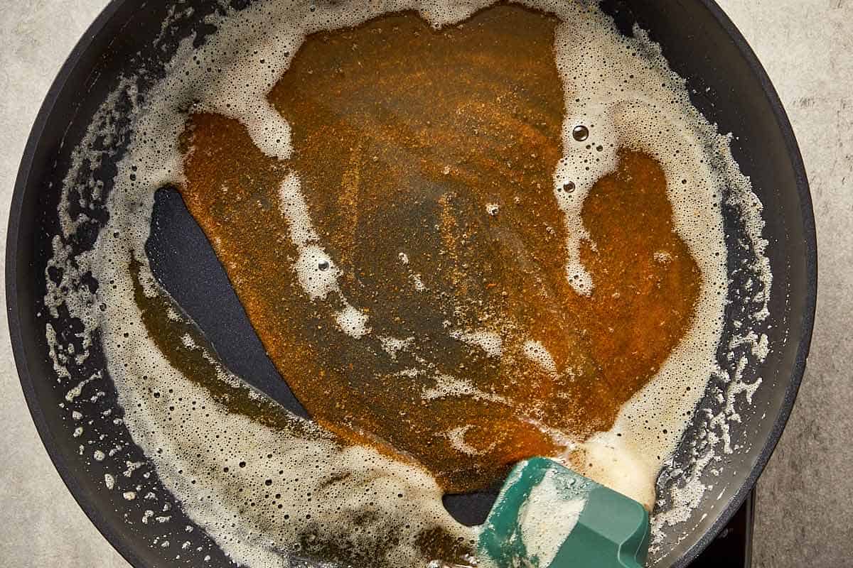 Butter browned in a pan with golden color and toasted milk solids, ready for Alfredo sauce.