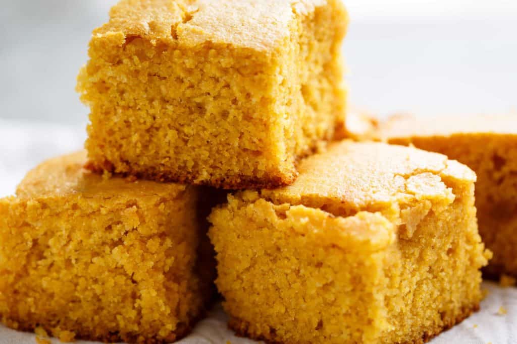 Easy Buttermilk Cornbread with a hint of honey is the good side to chili's, soups or stews! Crunchy buttery edges with a soft and fluffy centre!