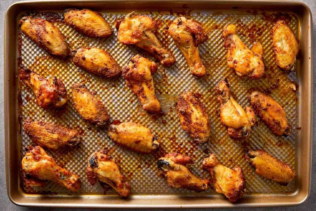 crispy baked chicken wings on tray fresh out of oven