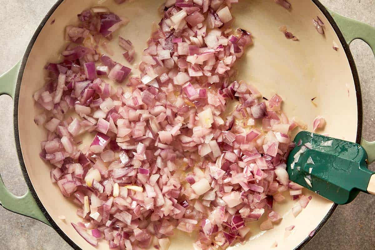 Onion being cooked in the melted ghee
