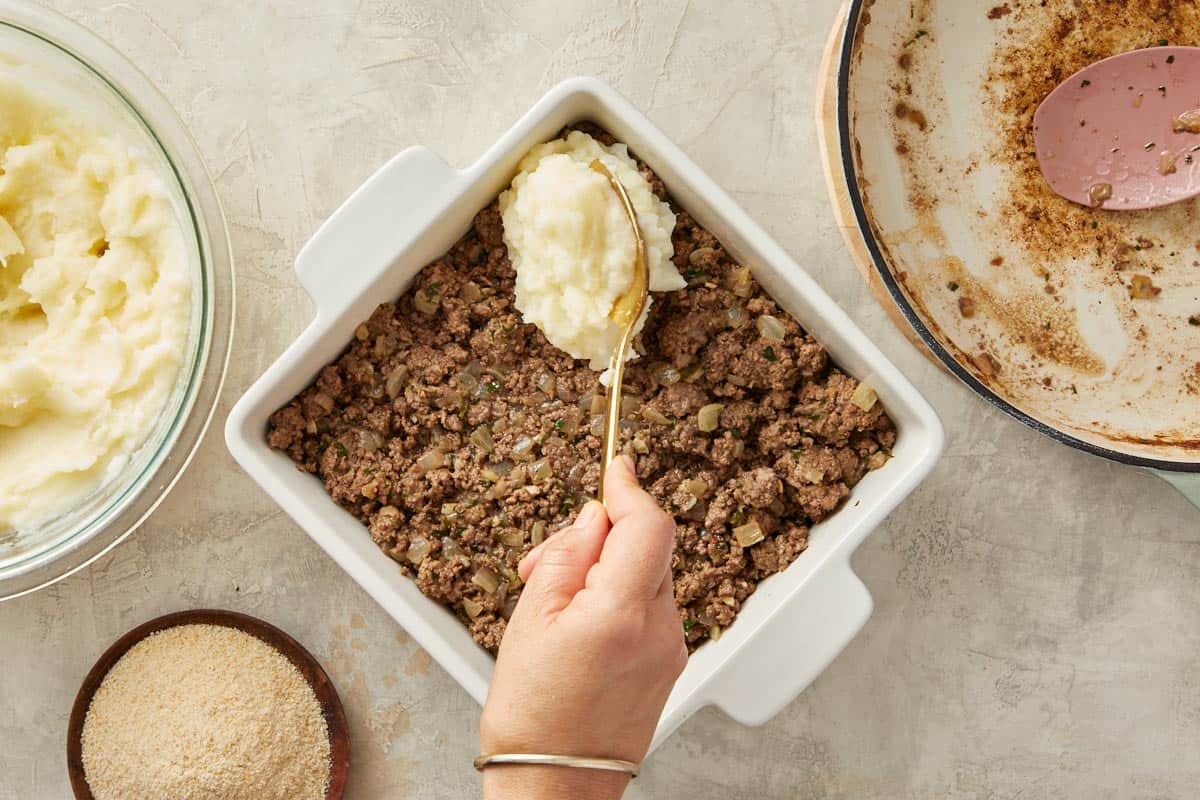 Mashed potatoes spread over the meat to make the topping.