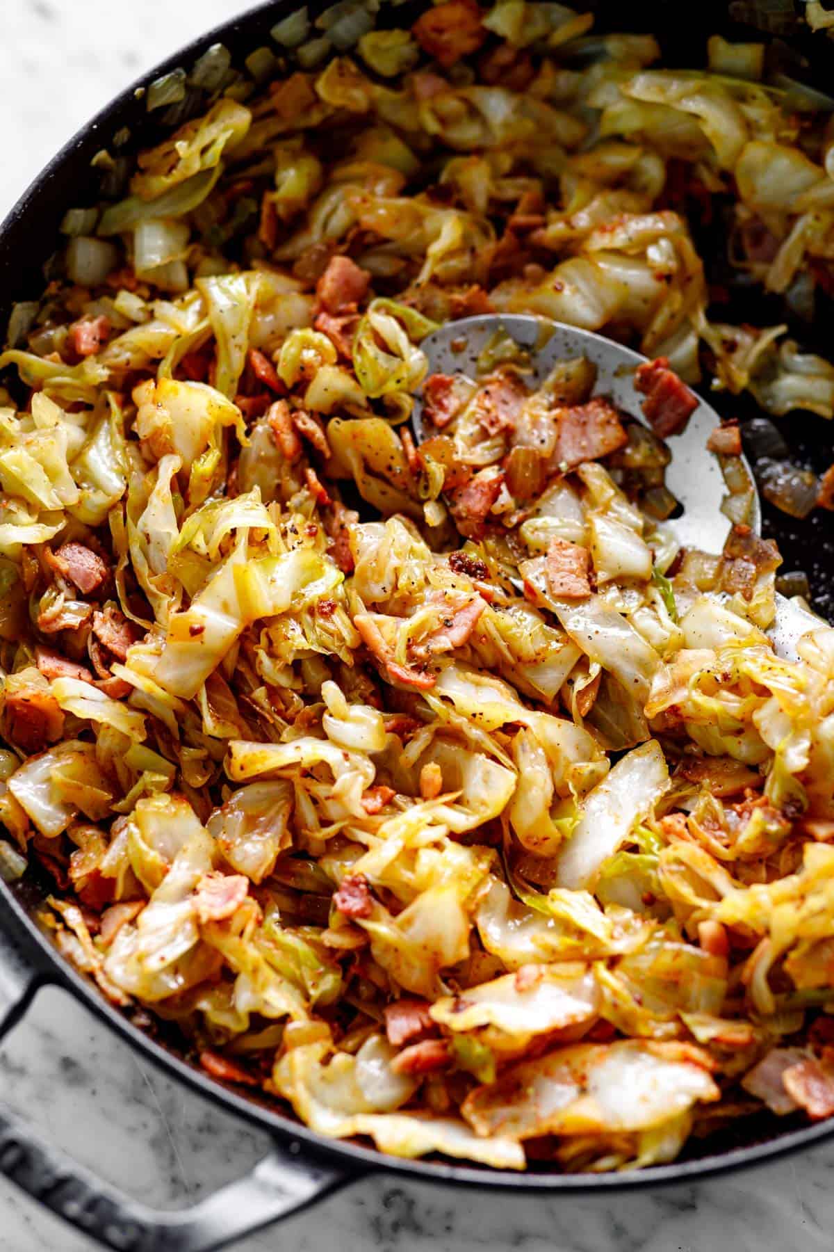 Bacon Fried Cabbage with spoon