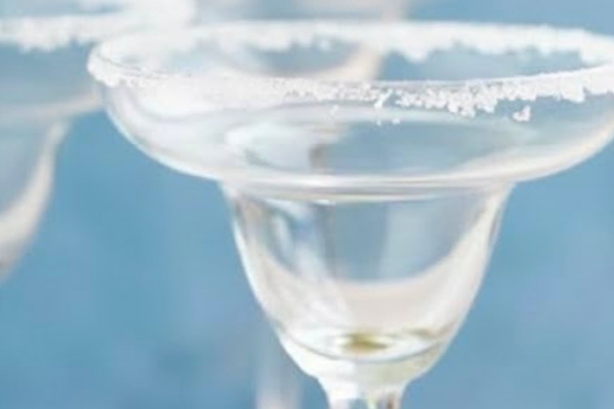 Pour the salt onto a small plate. Rub a lime wedge around the rim of each glass, then dip into the salt to coat evenly.