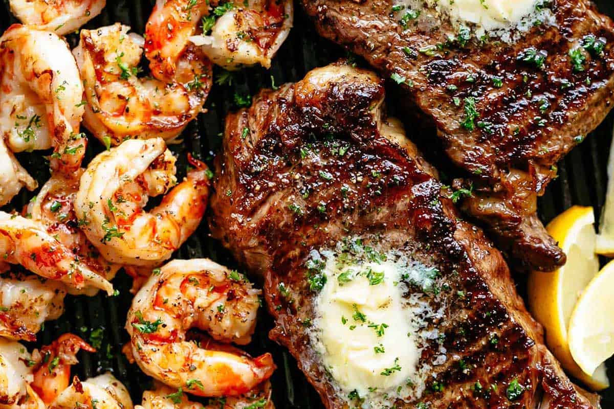 Close-up shot of Garlic Butter Grilled Steak And Shrimp.