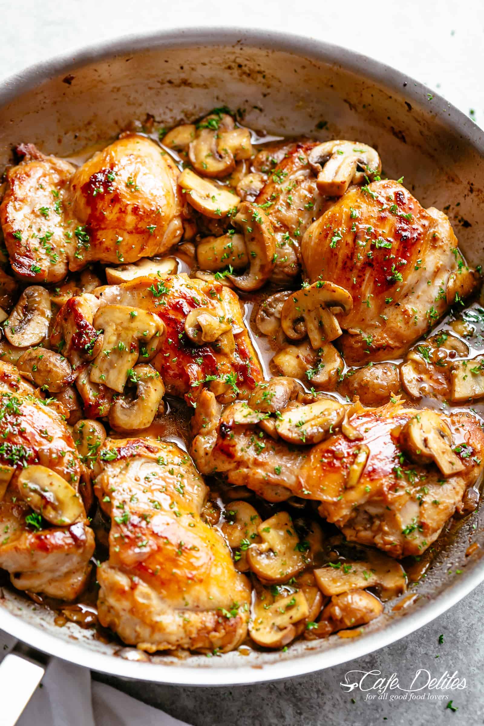 Golden seared chicken thighs in a good, buttery garlic mushroom sauce with a sprinkle of herbs is THE weeknight dinner everyone raves about! Serve over rice, pasta, mashed potatoes OR lower carb options like mashed cauliflower or zucchini noodles!