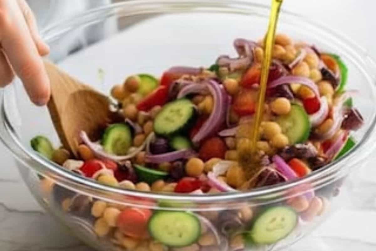 Pour in half of the dressing and toss the salad until coated.